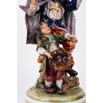 Polychrome Capodimonte porcelain sculpture group depicting a musician and a little beggar, 20th century