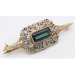 Jewelry - Yellow and white gold brooch with a tourmaline center stone...