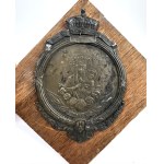 [CZĘSTOCHOWA] A plaque featuring an image of Our Lady of Częstochowa on a wooden base. A souvenir from Częstochowa. 1923.