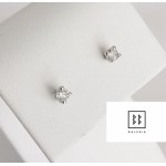 18-karat gold earrings with natural diamonds totaling 0.18 carats