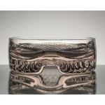 A bowl made of rose-patterned glass, with geometric decoration on the base, from the 1970s.