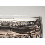 A bowl made of rose-patterned glass, with geometric decoration on the base, from the 1970s.