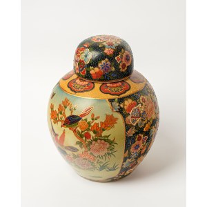 A ceramic, bulbous vase with a lid, known as the Elephant, most likely comes from Japan.