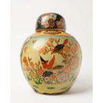 A ceramic, bulbous vase with a lid, known as the Elephant, most likely comes from Japan.