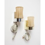 A pair of very ornate wall sconces, with a glass shade mounted on a plastic base. Origin: Scandinavia.