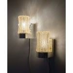 A pair of very ornate wall sconces, with a glass shade mounted on a plastic base. Origin: Scandinavia.