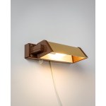 A wall lamp made of plastic. It works great as a reading lamp, and you can adjust the angle of the light. Made in Denmark.