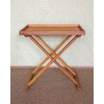 A fold-out side table with a movable tray. Manufactured by Askman, based on a design by Jorgen Miller, Denmark.