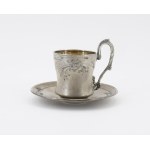 A cup and saucer with Art Nouveau decoration