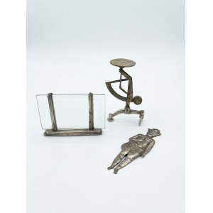 A trio of vintage metal objects, including a letter scale and an ex-voto