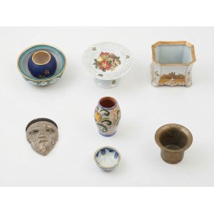 A collection of decorative items made of ceramic and metal