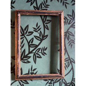 Rectangular frame made of ebony-stained and gilded wood, decorated with leaf scrolls