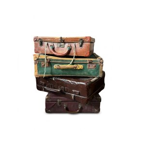 Lot of vintage, well-traveled suitcases from the 20th century