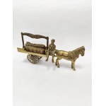 A brass figurine depicting a coal merchant