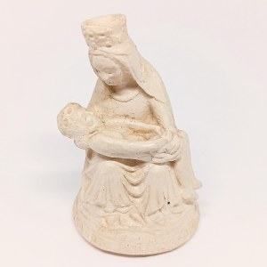 A plaster figurine of Michelangelo's *La Pietà*, signed