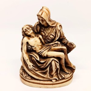 Handcrafted figurine of Michelangelo's *La Pietà* made from horn