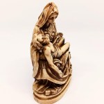 Handcrafted figurine of Michelangelo's *La Pietà* made from horn