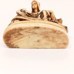Handcrafted figurine of Michelangelo's *La Pietà* made from horn