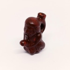 Handcrafted wooden figurine of the God of Fertility
