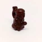Handcrafted wooden figurine of the God of Fertility