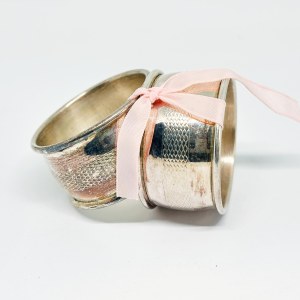 Two silver-plated napkin holders