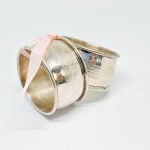 Two silver-plated napkin holders