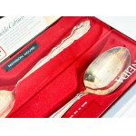 Two silver-plated Oneida spoons—a complete set