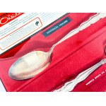 Two silver-plated Oneida spoons—a complete set