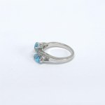 Silver ring with natural white and blue topaz stones