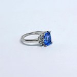 Silver ring with a natural London Blue topaz and white topazes