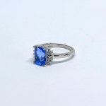 Silver ring with a natural London Blue topaz and white topazes