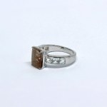 Silver ring with white quartz stones and an inclusion