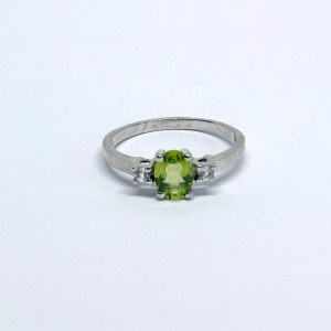 Silver ring with a natural peridot and white sapphires