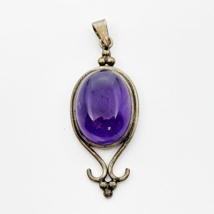 Silver pendant with a large amethyst cabochon