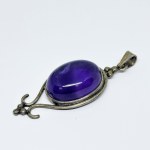 Silver pendant with a large amethyst cabochon