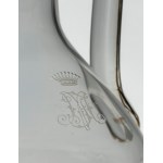 Crystal glass set with gold trim and an engraved crowned monogram.