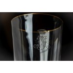 Crystal glass set with gold trim and an engraved crowned monogram.