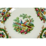 Porcelain service decorated in polychrome with floral motifs, birds, reserves, and green borders with gilding. Coalport, Broadway Green, 20th century.