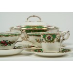 Porcelain service decorated in polychrome with floral motifs, birds, reserves, and green borders with gilding. Coalport, Broadway Green, 20th century.