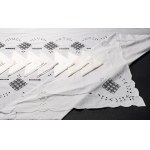 Rectangular tablecloth with ten matching white linen napkins.