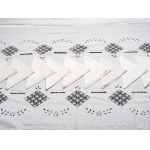 Rectangular tablecloth with ten matching white linen napkins.