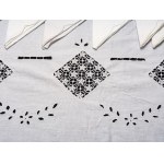 Rectangular tablecloth with ten matching white linen napkins.