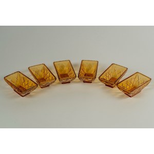 Six yellow glass appetizer plates decorated with a diamond pattern