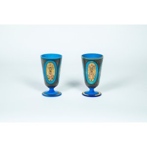 A pair of blue glass paste goblets with hand-painted decoration.