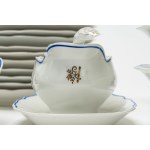 White porcelain set with a wavy edge outlined in blue and gold floral motifs. Richard Ginori, 1940s-1950s.