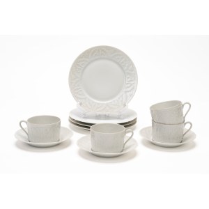 Four teacups with three saucers and four dessert plates made of white porcelain. Haviland Limoges, France.