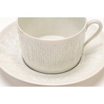 Four teacups with three saucers and four dessert plates made of white porcelain. Haviland Limoges, France.