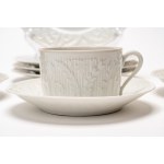 Four teacups with three saucers and four dessert plates made of white porcelain. Haviland Limoges, France.