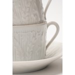 Four teacups with three saucers and four dessert plates made of white porcelain. Haviland Limoges, France.