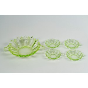 Fruit salad set consisting of a two-handled bowl and four small green glass bowls with water lily leaves.